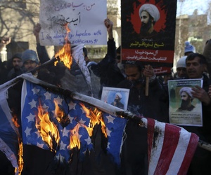 In this Sunday, Jan. 3, 2016 file photo, Iranian demonstrators burn representations of the U.S. and Israeli flags during a demonstration in front of the Saudi Arabian Embassy in Tehran, Iran. In this Sunday, Jan. 3, 2016 file photo, Iranian demonstrators burn representations of the U.S. and Israeli flags during a demonstration in front of the Saudi Arabian Embassy in Tehran, Iran.