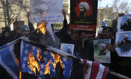 In this Sunday, Jan. 3, 2016 file photo, Iranian demonstrators burn representations of the U.S. and Israeli flags during a demonstration in front of the Saudi Arabian Embassy in Tehran, Iran. In this Sunday, Jan. 3, 2016 file photo, Iranian demonstrators burn representations of the U.S. and Israeli flags during a demonstration in front of the Saudi Arabian Embassy in Tehran, Iran.