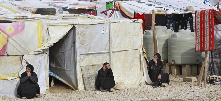 Syrian refugees women sitting outside their tents, during the visit of Filippo Grandi, the United Nations High Commissioner for Refugees, UNHCR, to a camp in the town of Saadnayel.