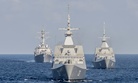 The Republic of Singapore Navy’s RSS Intrepid (69), right, RSS Supreme (73), center, and the U.S. Navy destroyer USS Lassen (DDG 82), left, during a military drill in the South China Sea.