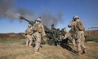 U.S. Marines with Task Force Spartan, 26th Marine Expeditionary Unit (MEU), on Fire Base Bell, Iraq, fire an M777A2 Howitzer at an ISIS infiltration route March 18, 2016. 
