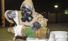 An EOD expert wraps the ordinance in an attempt to seal a ‘dirty bomb,’ so that it will not continue to leak out hazardous material, June 3, 2013.