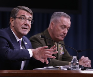 Defense Secretary Ash Carter, accompanied by Joint Chiefs Chairman Gen. Joseph Dunford, speaks during a news conference at the Pentagon, Friday, March 25, 2016.