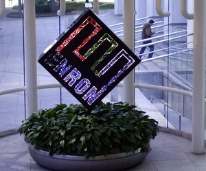 A colorful revolving Enron Corp. logo spins in the lobby of the enrgy company's downtown Houston headquarters in a file photo from Feb. 11, 2002, as an unidentified man enters the building. 