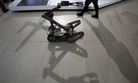 A remote controlled robot cast a shadow at an exhibition on police equipment and anti-terror technologies held in Beijing, China, Thursday, May 19, 2011.