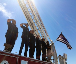 Albuquerque law enforcement officers escort the body of a New Mexico police officer who was shot and killed during a traffic stop as the procession leaves Albuquerque, N.M., Monday, Aug. 15, 2016. 