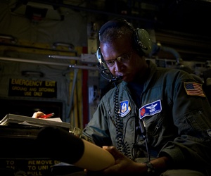 U.S. Air Force Master Sgt. Vince Burden, annotates the serial number of a dropsonde on board a WC-130J Super Hercules aircraft over the Atlantic Ocean Sept. 17, 2010.