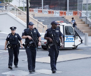 Port Authority police officers patrol the World Trade Center, Monday, Aug. 15, 2016, in New York. 