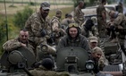 Russian-backed forces in eastern Ukraine are using rapidly innovating IT and EW tactics. Here, Ukrainian servicemen ride an armored vehicle near Krasnoarmiisk in eastern Ukraine in 2015. Russian-backed forces in eastern Ukraine are using rapidly innovating IT and EW tactics. Here, Ukrainian servicemen ride an armored vehicle near Krasnoarmiisk in eastern Ukraine in 2015.