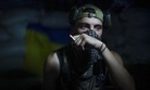 In this photo taken on Friday, Aug. 26, 2016, a Ukrainian soldier smokes in the village of Marinka, near Donetsk, eastern Ukraine. More than 9,500 people have been killed in the fighting that began in April 2014, according to United Nations figures,