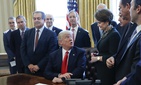 President Donald Trump looks over to Marillyn Hewson, Lockheed Martin chairman, CEO and president, before signing an executive order in the Oval Office on Feb. 24. President Donald Trump looks over to Marillyn Hewson, Lockheed Martin chairman, CEO and president, before signing an executive order in the Oval Office on Feb. 24.