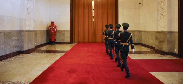 Uniformed guards march inside the Great Hall of the People in Beijing, China, Tuesday, May 16, 2017. 