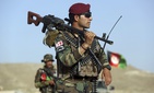 Afghan National Army soldiers stand guard at a checkpoint on the outskirts of Kabul, Afghanistan, Monday, Aug. 21, 2017. Deep in the mountains of eastern Afghanistan, on the front lines against Taliban and Islamic State fighters.