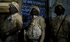 Pakistani paramilitary troops take position during a gunbattle with militants in Karachi, Pakistan in April.