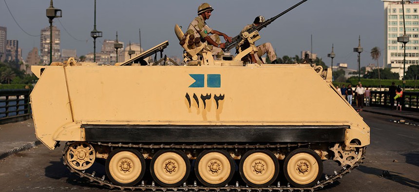 An Egyptian army soldier guards an entrance to Tahrir Square