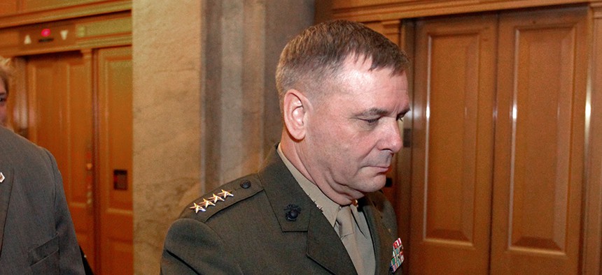Gen. James Cartwright walks out after speaking on Capitol Hill