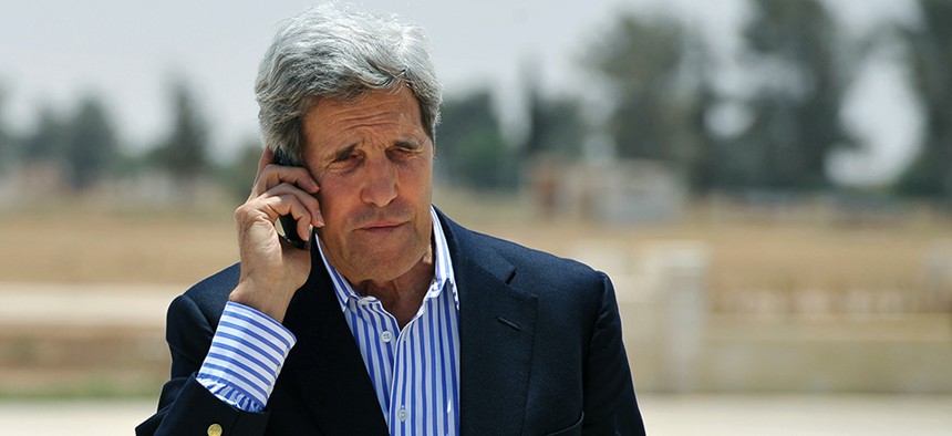 Secretary of State John Kerry speaking on the phone in Jordan