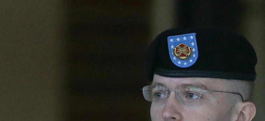Army Pfc. Bradley Manning being escorted outside a courthouse at Fort Meade, Md. 