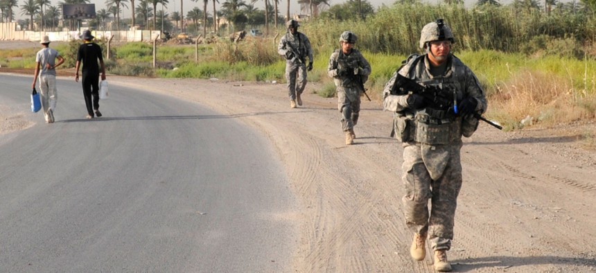 Troops with the 1st Battalion, 7th Field Artillery Regiment patrol in Iraq in 2011.
