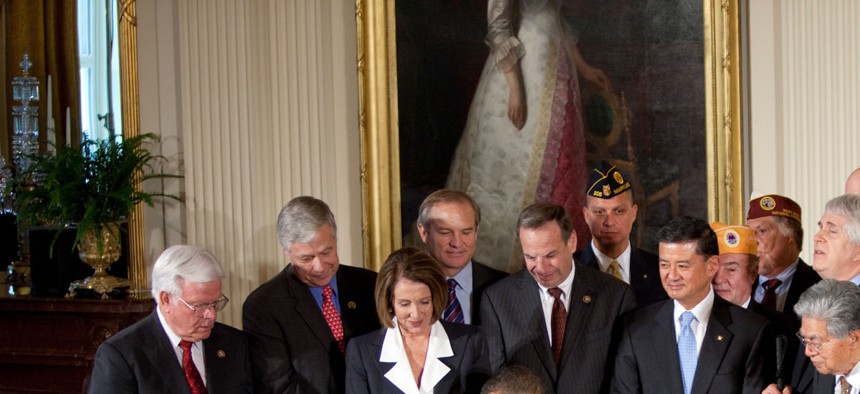 President Obama and congressional leaders signing the Veterans Health Care Budget Reform and Transparency Act