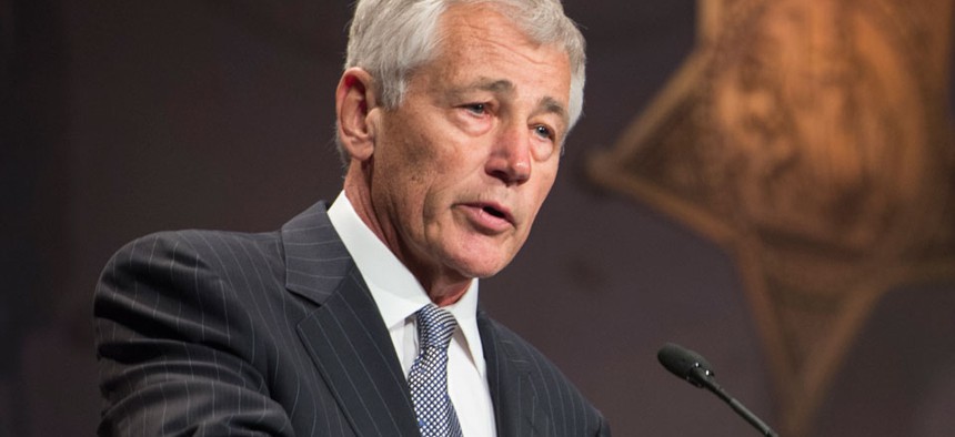 Officials are urging Defense Secretary Chuck Hagel to divide power of Cyber Command and NSA operations.