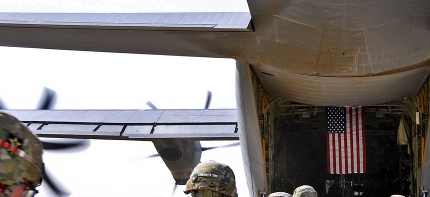 Soldiers board an Air Force C-130 bound for Joint Base Lewis-McChord