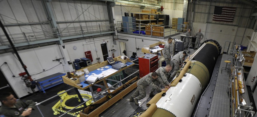 Airmen working on a Minuteman III ICBM at Vandenberg Air Force Base, Calif. 