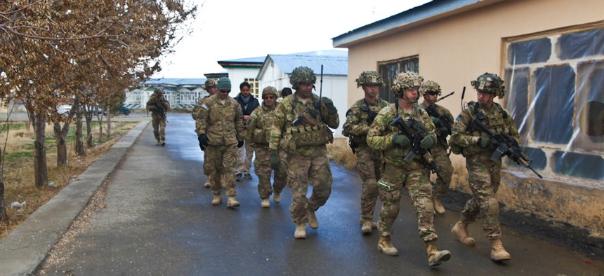 U.S. soldiers from the 3rd Brigade Combat Team, 10th Mountain Division head to a meeting about the upcoming presidential election at Forward Operating Base Rushmore in Paktika province last week.