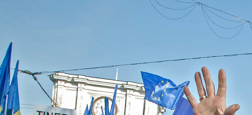Moldovan women change pro-European Union slogans in Chisinau, Moldova, last November.