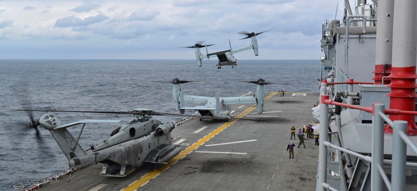 A group of MV-22 Ospreys taking off from the USS Bonhomme Richard during operations in the East China Sea