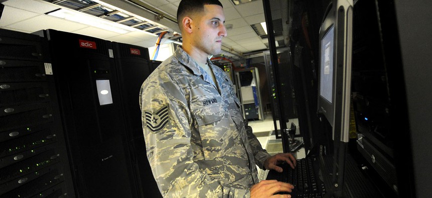 A non-commissioned officer with the 627th Communications Squadron works on a computer system at Joint Base Lewis-McChord in Washington