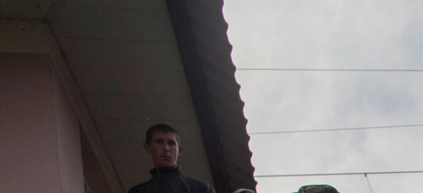 Pro-Ukrainian militiamen stand guard near a barricade in Slovyansk, Ukraine on May 4, 2014.
