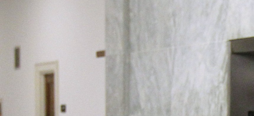 Veterans Affairs Secretary Eric Shinseki waits for an elevator at the Rayburn House Office Building on Capitol Hill. 