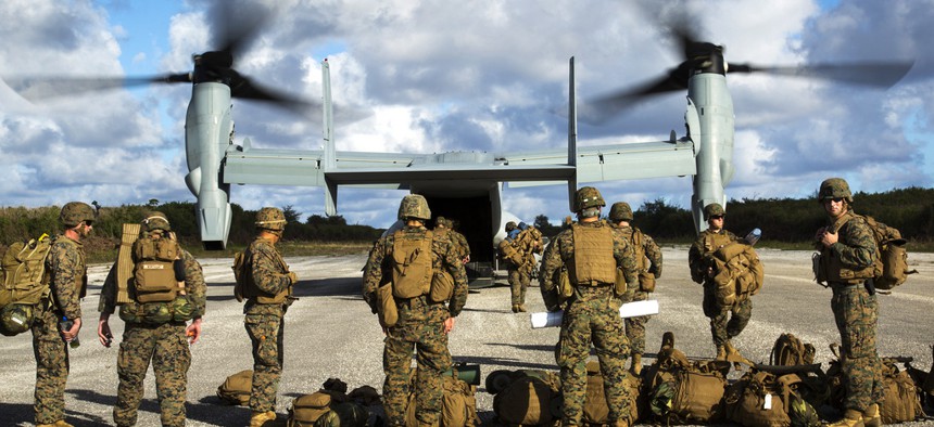 Troops with the Marine Air-Ground Task Force disembark from an MV-22B Osprey at Baker runway in the Philippines on December 9, 2013. 
