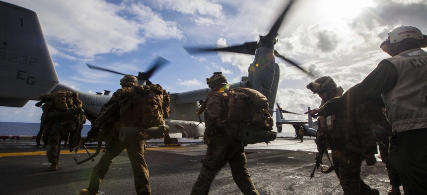 Troops with the 22nd Marine Expeditionary Unit load onto an MV-22 Osprey before a bilateral exercise with the Hellenic Army on March 7, 2014. 
