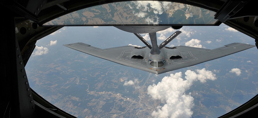 A KC-135 Stratotanker with the 22nd Air Refueling Wing refuels a B-2 Spirit on July 12, 2012. 
