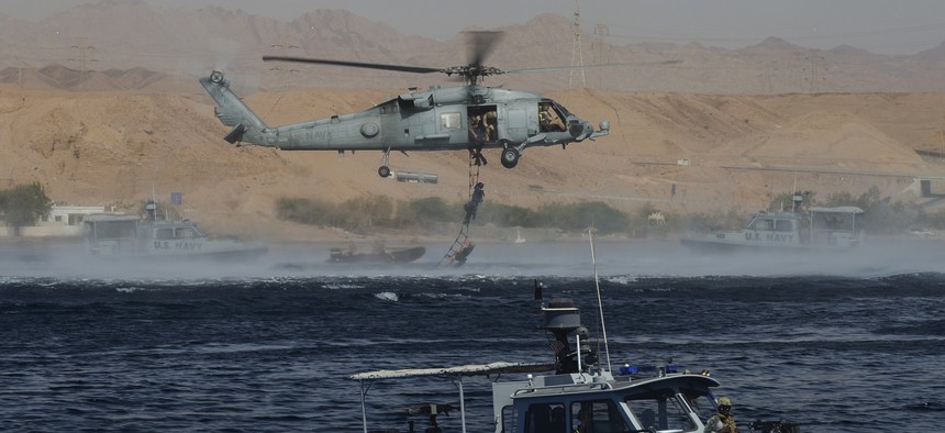 Explosive Ordnance Technicians assigned to CTG 56.1 conduct mine countermeasure exercises during Exercise Eager Lion 2014 in the Gulf of Aqaba, Jordan, on May 28, 2014. 