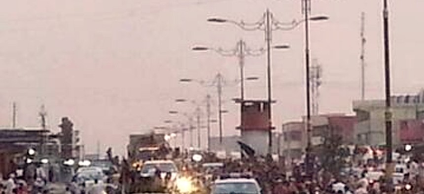 Al Qaeda inspired militants parade down the street of Mosul, Iraq, on June 11, 2014.