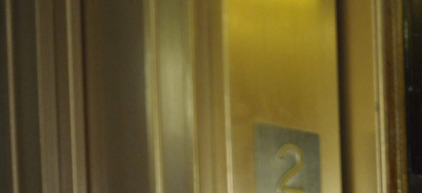 Sen. Tom Coburn, R-Okla., walks into an elevator after a meeting on Capitol Hill, on December 31, 2012.