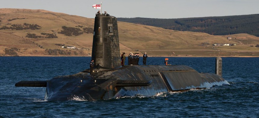 The HMS Victorious, one of the United Kingdom's Trident Class submarines, emerges from Devonshire Dock Hall in Barrow. 