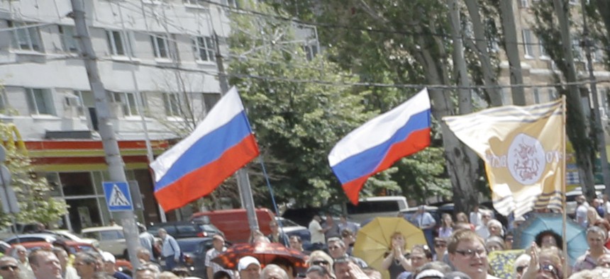 Pro-Russian fighters in the city of Donetsk gather to take an oath of allegiance to the self-proclaimed Donetsk People, on June 22, 2014.