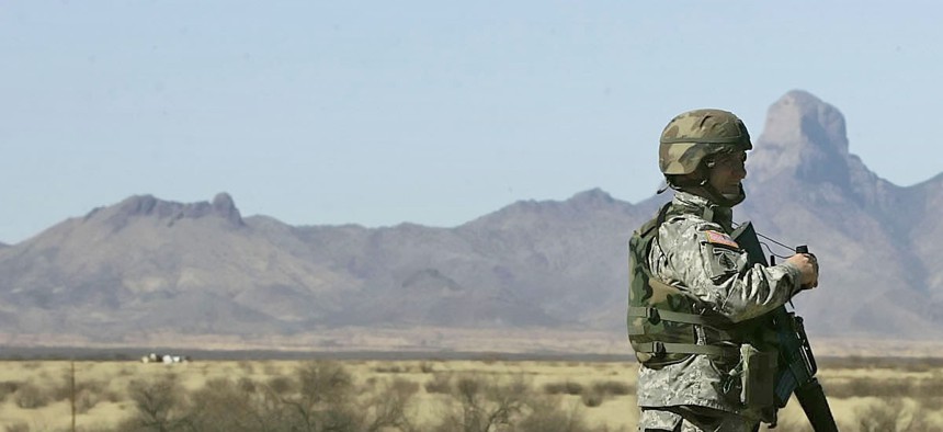 A Tennessee National Guardsman stands watch near the Arizona-Mexico border in Sasabe, Ariz., March 1, 2007.