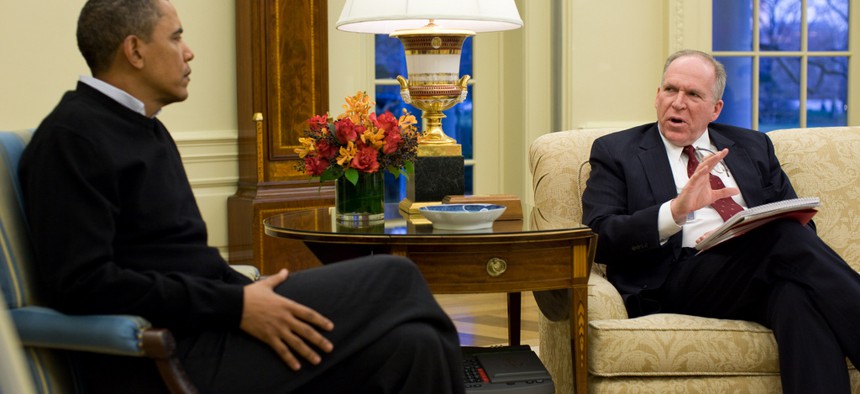 John Brennan briefs the President in the Oval Office.