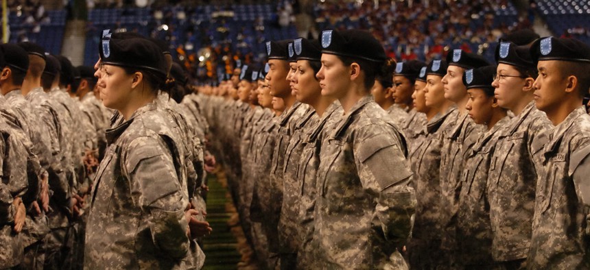 New soldiers take the oath of enlistment during a ceremony at the Alamodome in San Antonio, Texas.