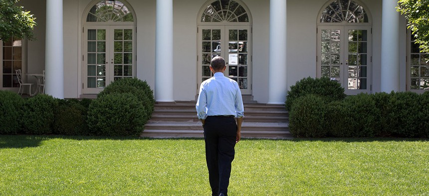 President Obama walks through the Rose Garden of the White House on May 6, 2014. 