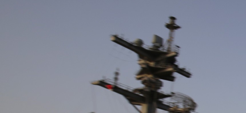 An F/A 18 Hornet coming from Iraq lands on the flight deck of the USS George H.W. Bush on August 10, 2014.