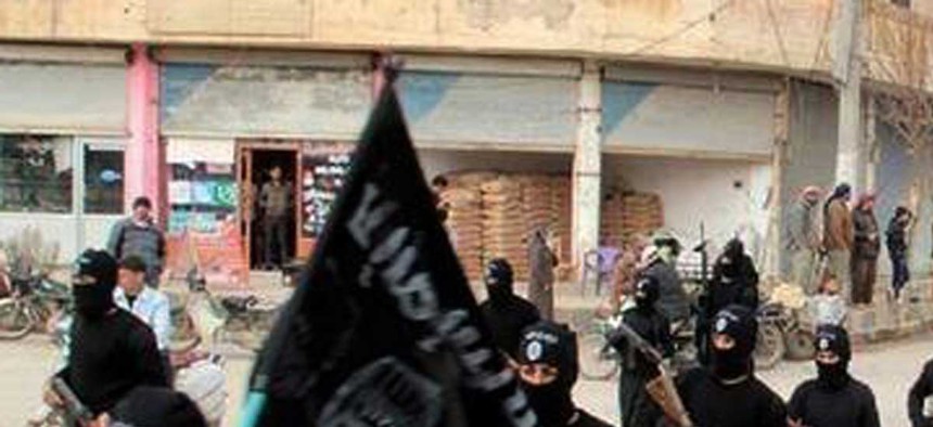 Fighters from ISIL march in Raqqa, Syria, on January 14, 2014. 