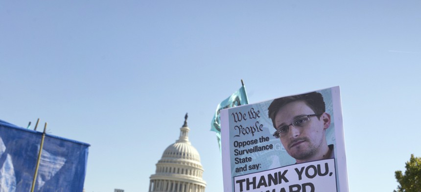 Demonstrators rally at the Capitol to protest the NSA's surveillance programs. 