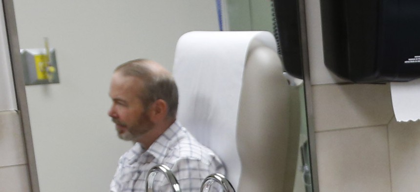 A veteran speaks with a physician at the Veterans Administration Medical Center in Oklahoma City, Okla., on June 12, 2014. 