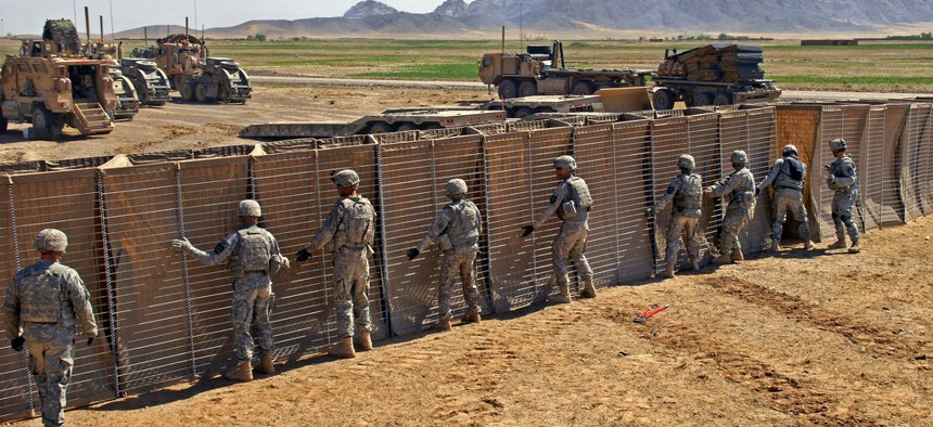 U.S. Army Soldiers construct a police checkpoint in Robat, Afghanistan, on March 19, 2010.